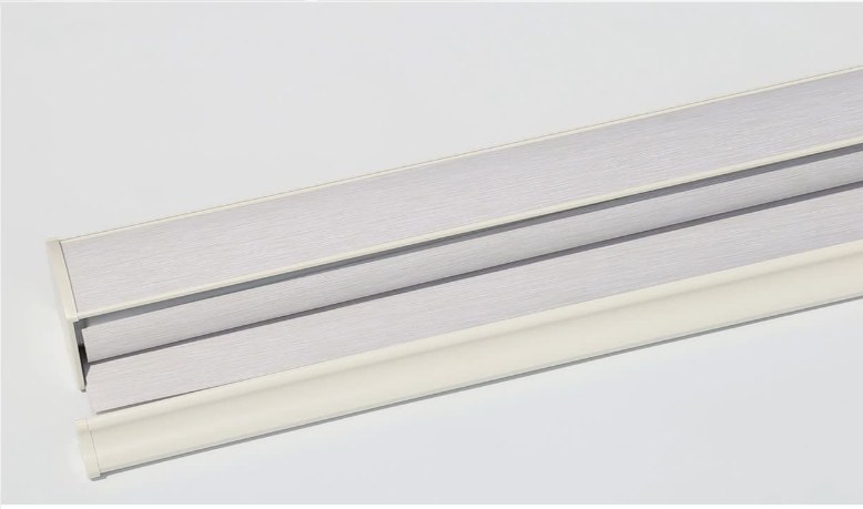 Close-up of a manual zebra blind headrail and fabric