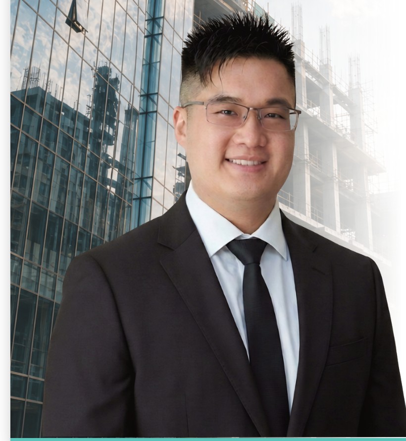Stanford Siu, Chief Executive Officer of AEGIS Building Supplies, in front of a glass office tower