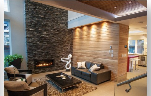Living room with a stacked-stone fireplace wall and wood ceiling