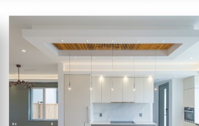 Open-plan kitchen with a wood-slat coffered ceiling